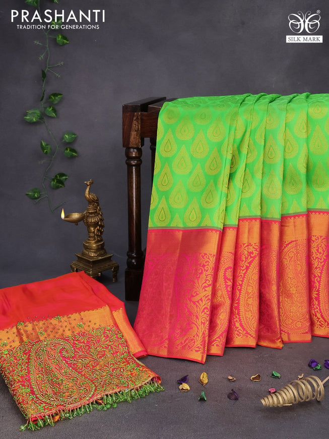 Pure kanchipuram silk saree light green and dual shade of pinkish orange with allover zari woven buttas and long zari woven border & embroidery work blouse