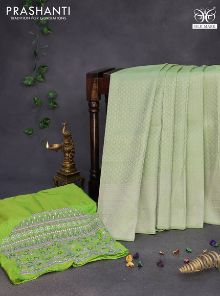 Pure kanchipuram silk saree pastel green with allover silver zari woven brocade weaves and silver zari woven border & embroidery work blouse