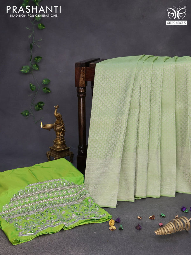 Pure kanchipuram silk saree pastel green with allover silver zari woven brocade weaves and silver zari woven border & embroidery work blouse