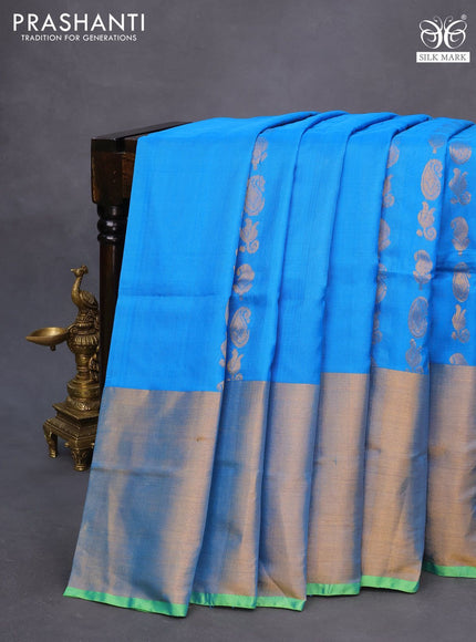 Pure uppada silk saree cs blue and parrot green with allover zari woven paisley buttas and long zari woven border