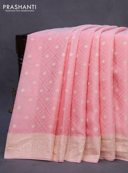 Pure banarasi crepe silk saree light pink with allover self emboss & zari buttas and woven border