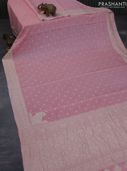 Pure banarasi crepe silk saree light pink with allover self emboss & zari buttas and woven border