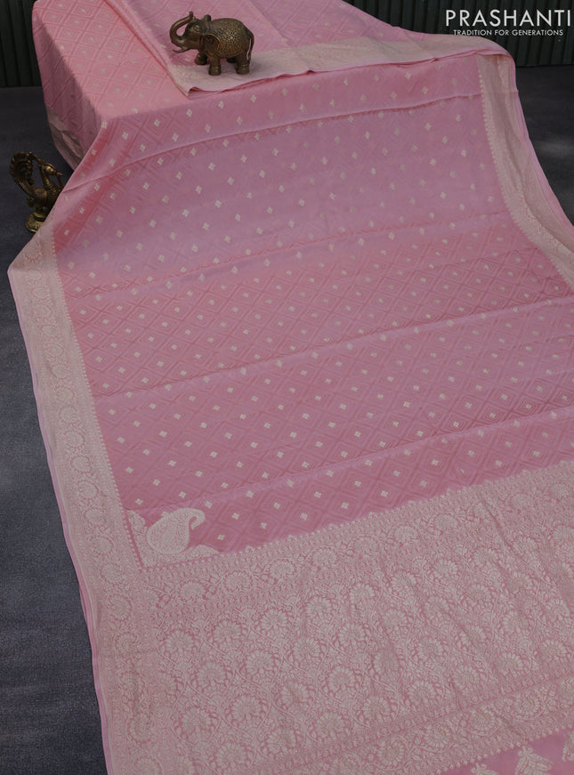 Pure banarasi crepe silk saree light pink with allover self emboss & zari buttas and woven border