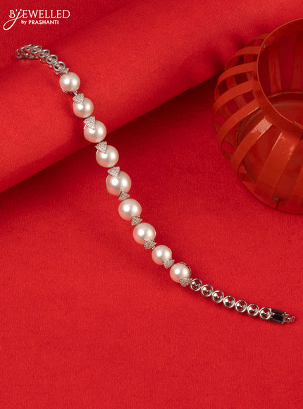 Bracelet with cz stones and pearls in silver finish