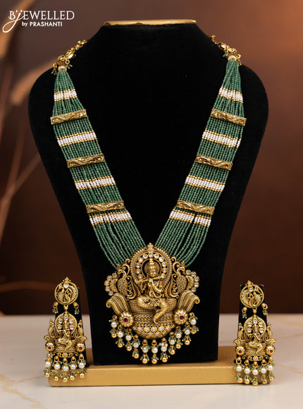 Antique beaded haaram krishna pendant with ruby and kundan stones in pearl & golden beads hangings