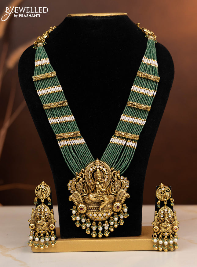 Antique beaded haaram krishna pendant with ruby and kundan stones in pearl & golden beads hangings