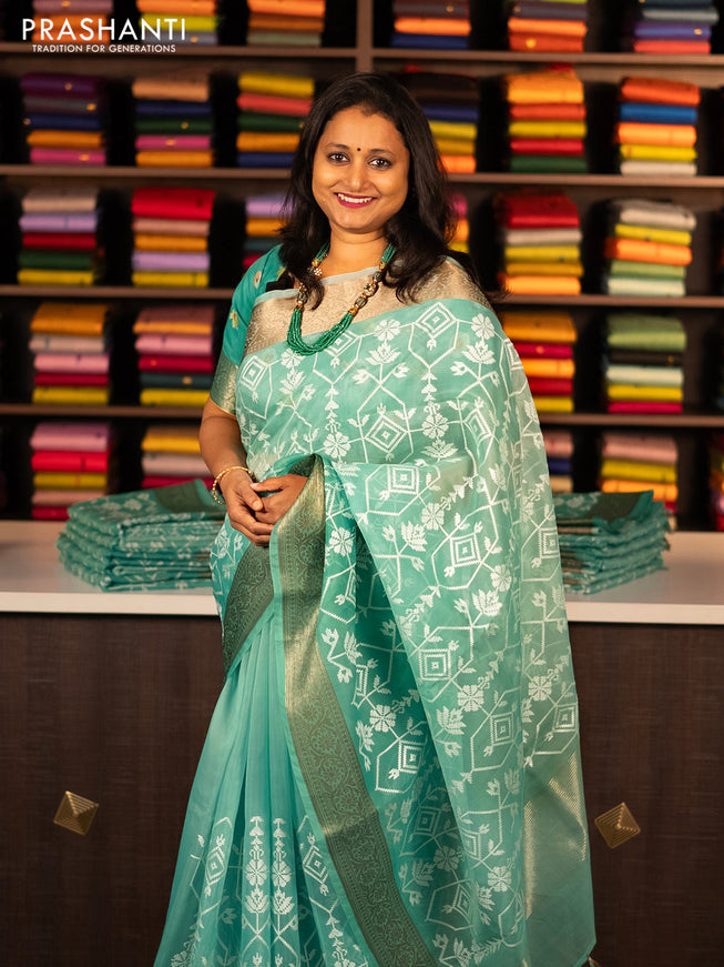 Banarasi semi organza saree teal green with allover embroidery work and woven border