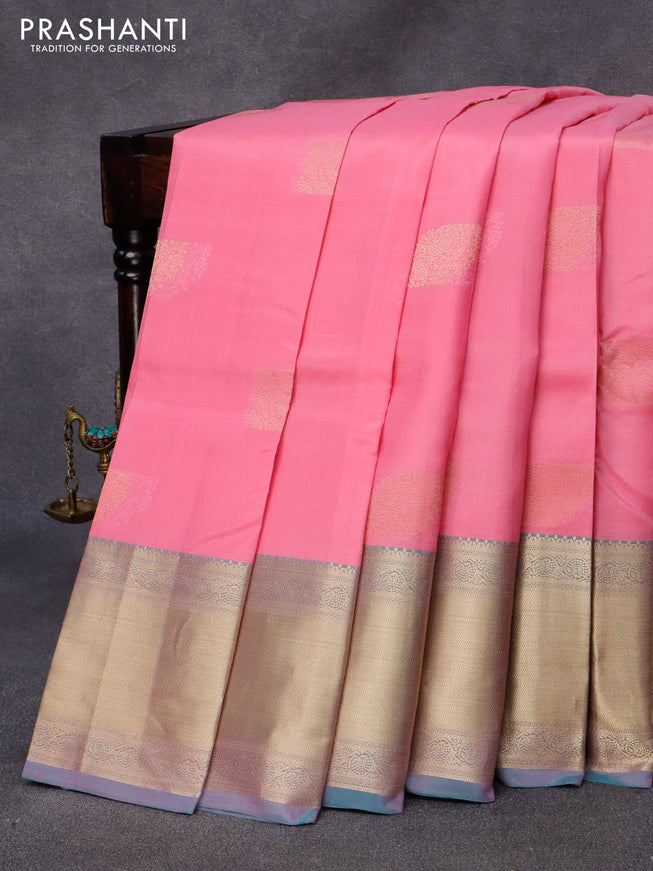 Pure kanjivaram silk saree light pink and dual shade of teal green with zari woven buttas and zari woven border