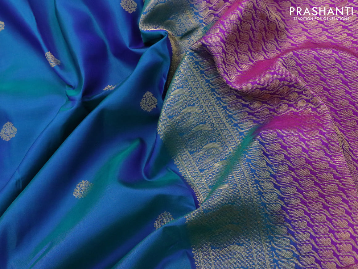 Pure kanjivaram silk saree dual shade of bluish green and purple with zari woven buttas and long annam zari woven border