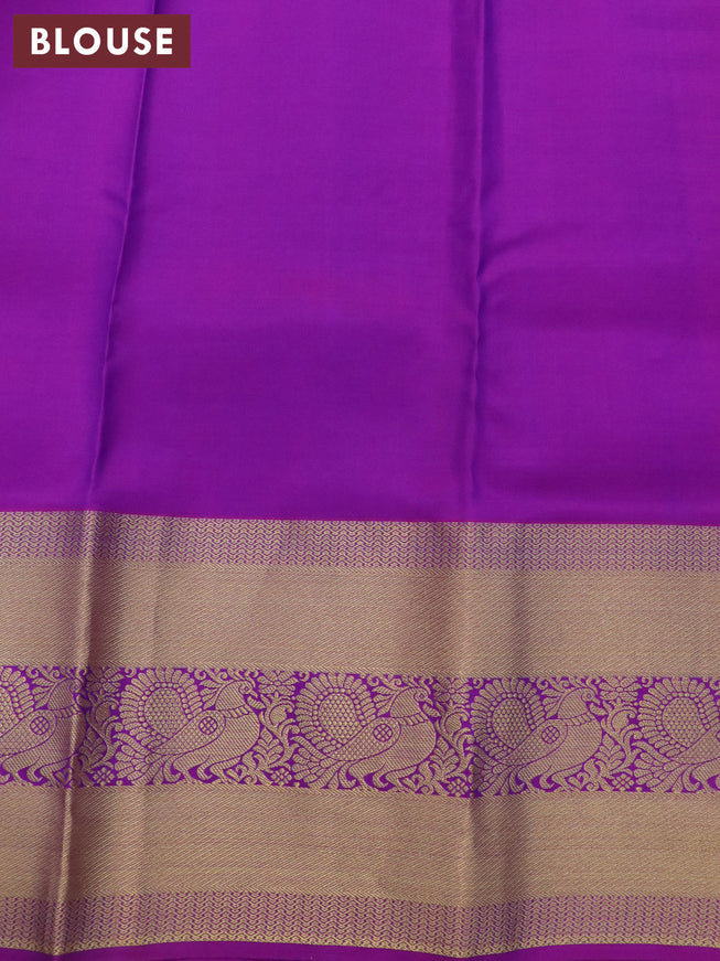 Pure kanjivaram silk saree dual shade of bluish green and purple with zari woven buttas and long annam zari woven border