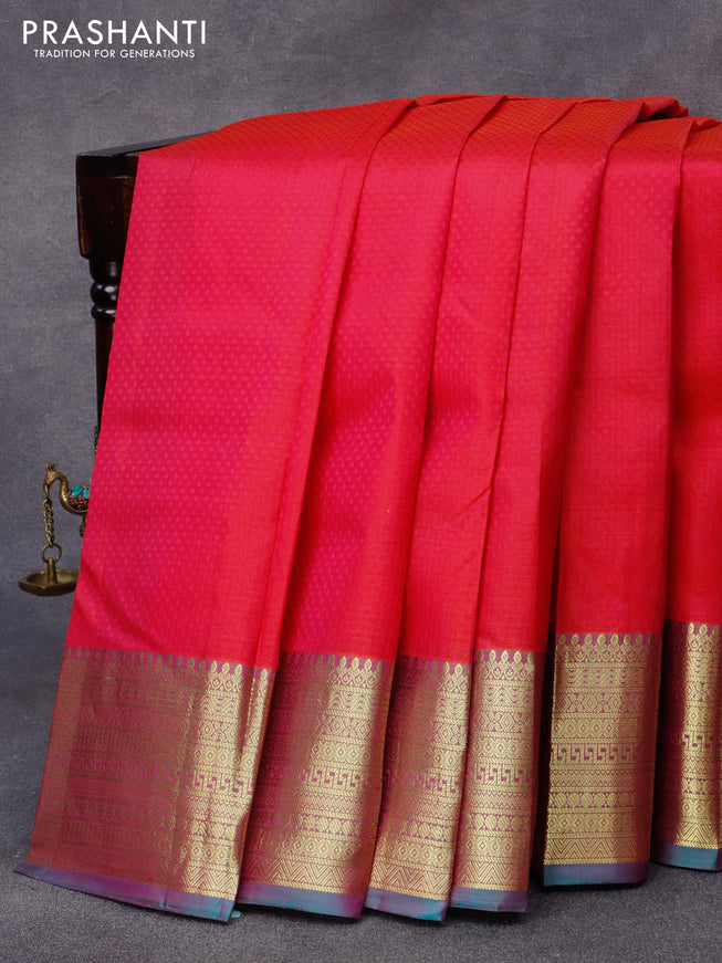 Pure kanjivaram silk saree dual shade of pinkish orange and dual shade of greenish pink with allover self emboss and zari woven border