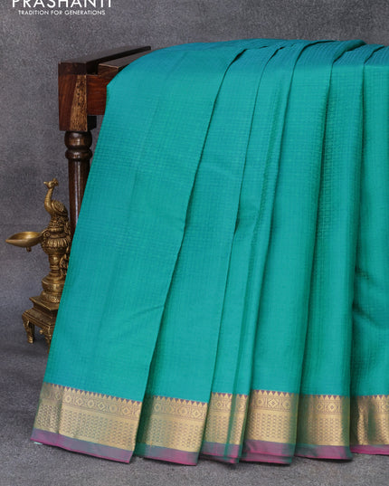 Pure kanjivaram silk saree teal green and pink with allover self emboss and zari woven border
