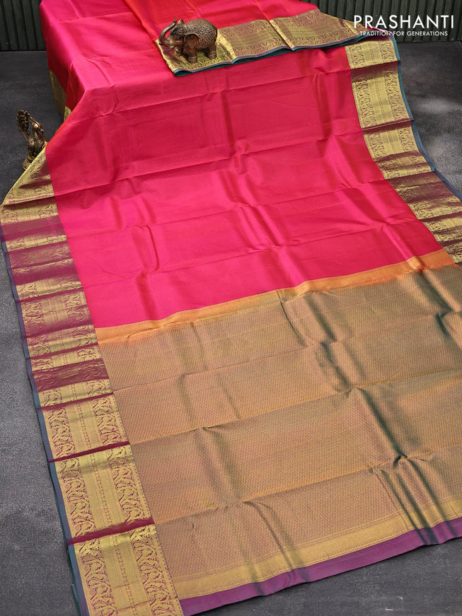 Pure kanjivaram silk saree dual shade of pinkish orange and dual shade of green with allover self emboss and zari woven border
