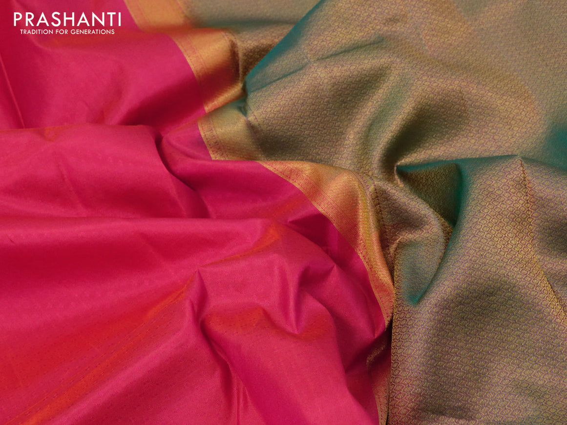 Pure kanjivaram silk saree dual shade of pinkish orange and dual shade of green with allover self emboss and zari woven border