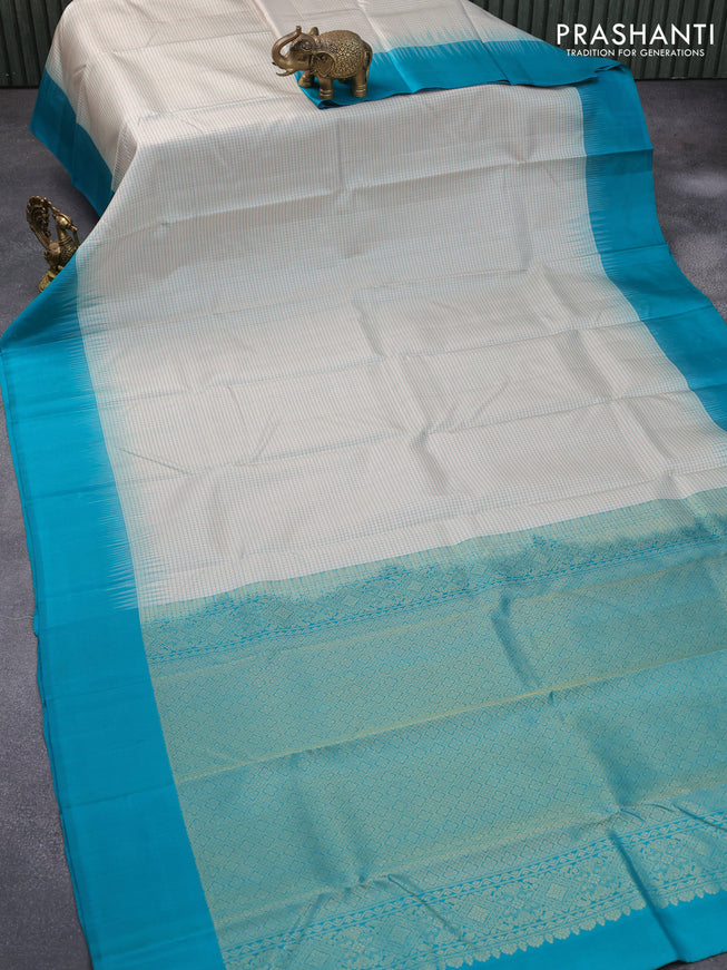 Pure kanjivaram silk saree off white and teal blue with allover thread woven checked pattern and simple border
