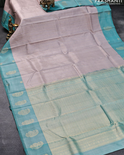 Pure kanjivaram silk saree grey and teal green with allover zari weaves and zari woven butta border