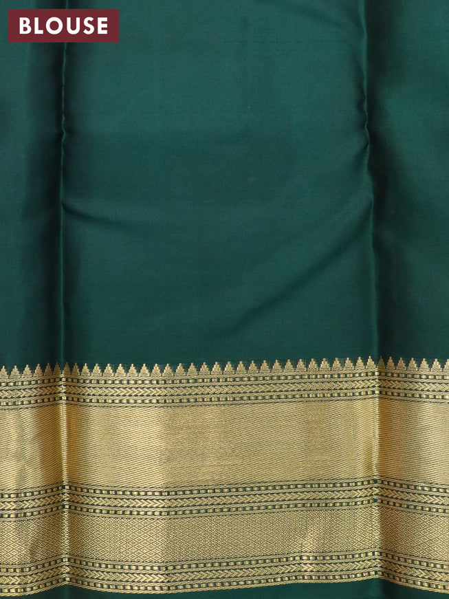 Pure kanjivaram silk saree reddish pink and bottle green with zari woven buttas and zari woven border