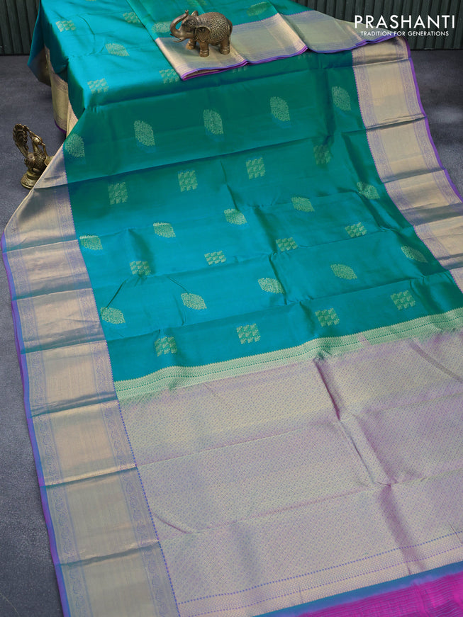 Pure kanjivaram silk saree teal green shade and dual shade of purple with thread & zari woven buttas and long zari woven border