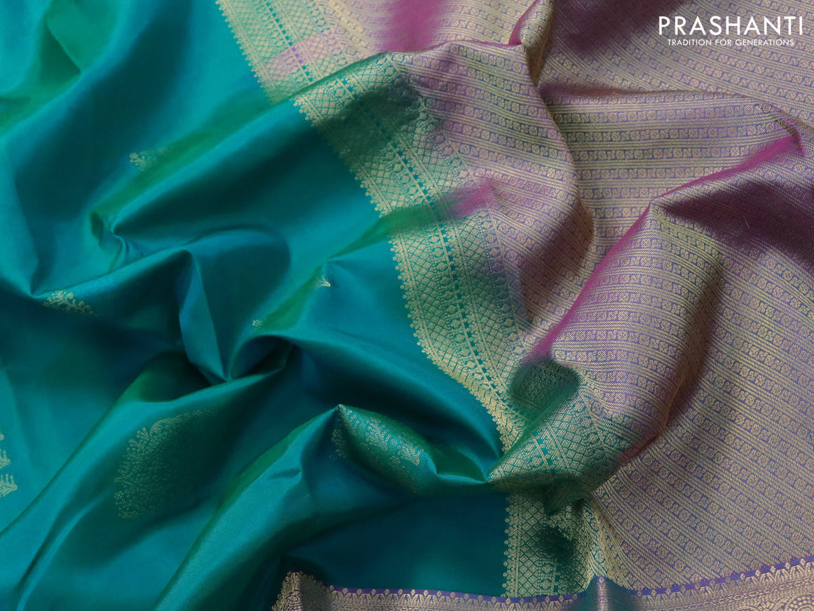 Pure kanjivaram silk saree teal green shade and dual shade of purple with thread & zari woven buttas and long zari woven border