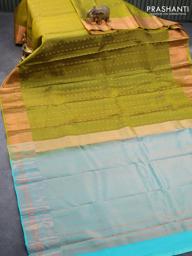 Pure kanjivaram silk saree mehendi green and teal blue with allover copper zari woven butta weaves and copper zari woven border