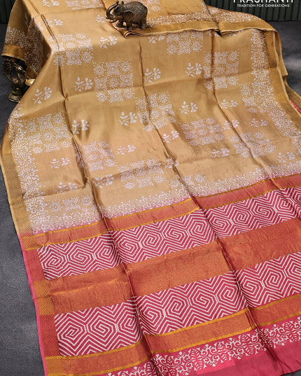 Banana silk saree sandal and pink with allover floral prints and zari woven border