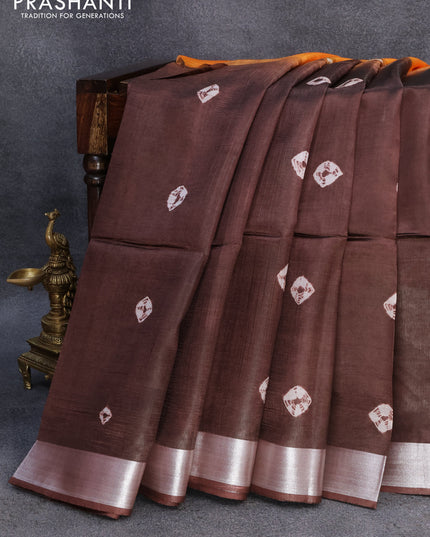 Banana silk saree orange and deep coffee brown with allover batik butta prints and silver zari woven border