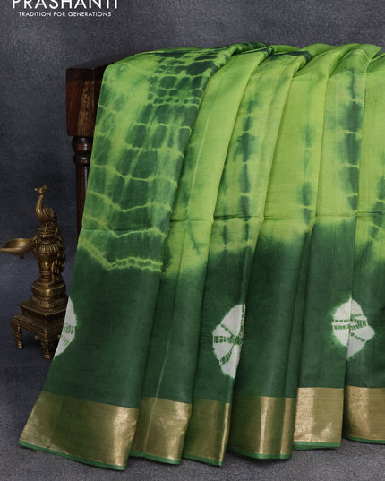 Banana silk saree light green and green with tie and dye batik butta prints and zari woven border