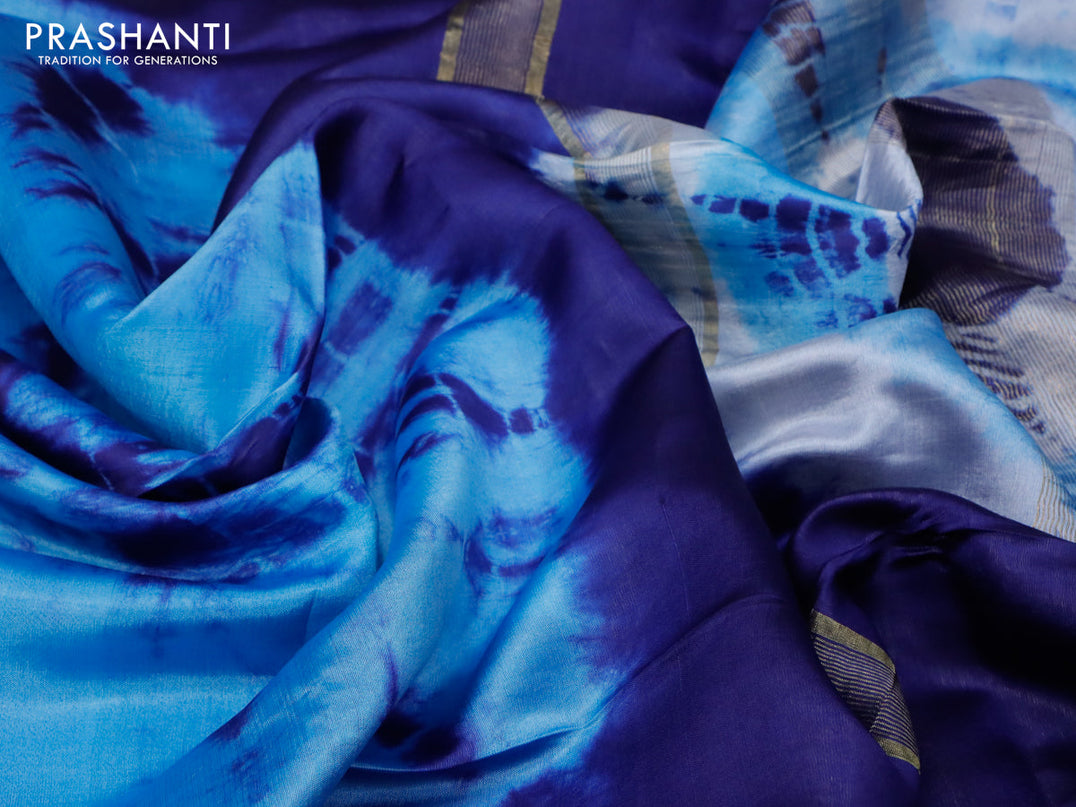 Banana silk saree light blue and navy blue with tie and dye batik butta prints and zari woven border