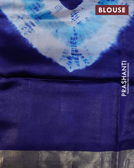 Banana silk saree light blue and navy blue with tie and dye batik butta prints and zari woven border
