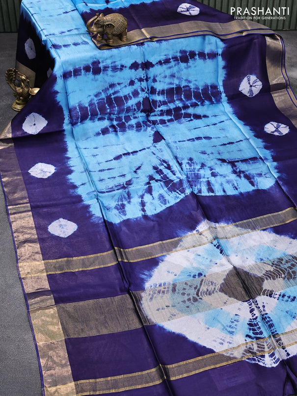 Banana silk saree light blue and dark blue with tie and dye batik butta prints and zari woven border