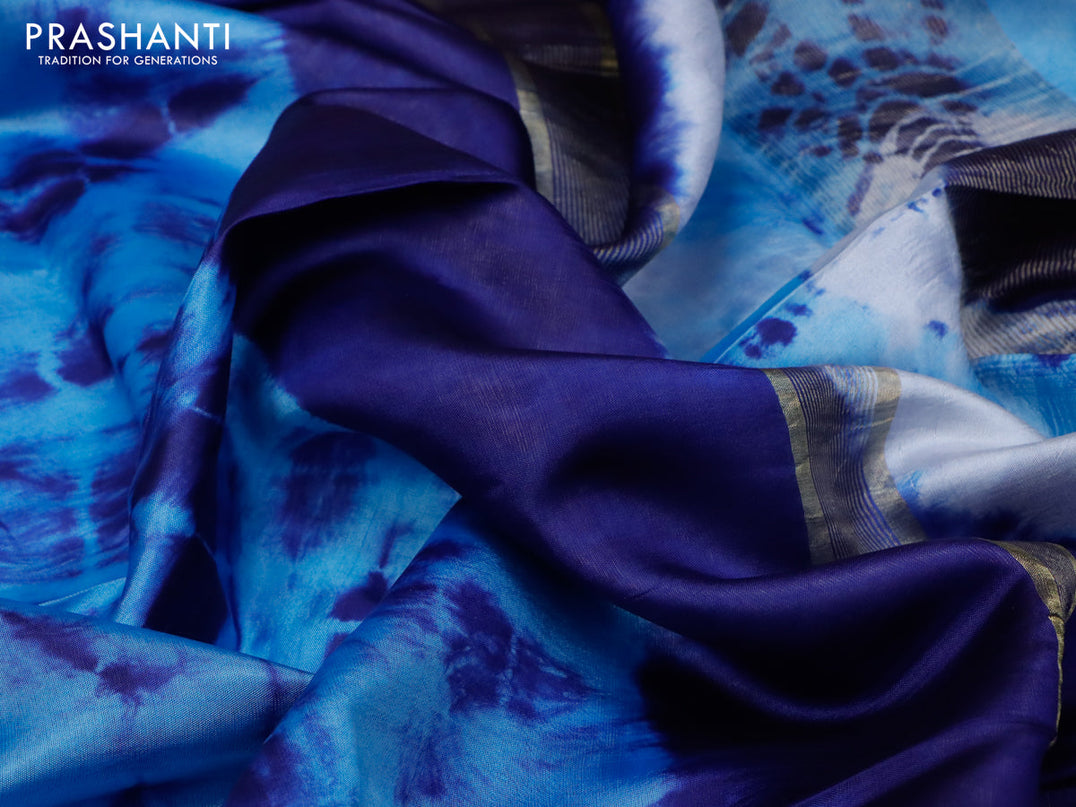 Banana silk saree light blue and dark blue with tie and dye batik butta prints and zari woven border