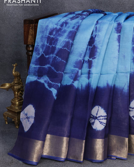 Banana silk saree light blue and blue with tie and dye batik butta prints and zari woven border