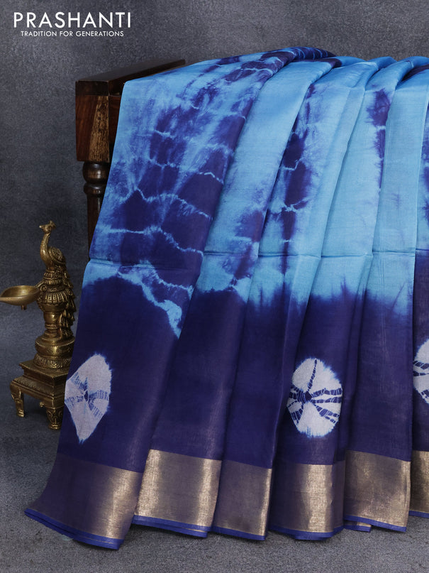 Banana silk saree light blue and blue with tie and dye batik butta prints and zari woven border