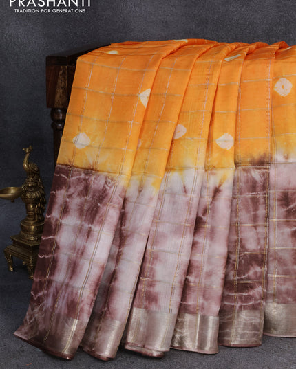 Banana silk saree orange and brown with allover zari checked pattern & batik butta prints and zari woven border
