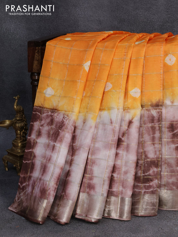 Banana silk saree orange and brown with allover zari checked pattern & batik butta prints and zari woven border