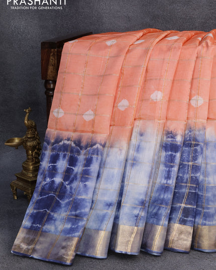 Banana silk saree peach orange and blue with allover zari checked pattern & batik butta prints and zari woven border