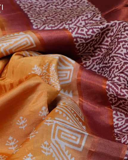 Banana silk saree orange and deep maroon with allover butta prints and copper zari woven border