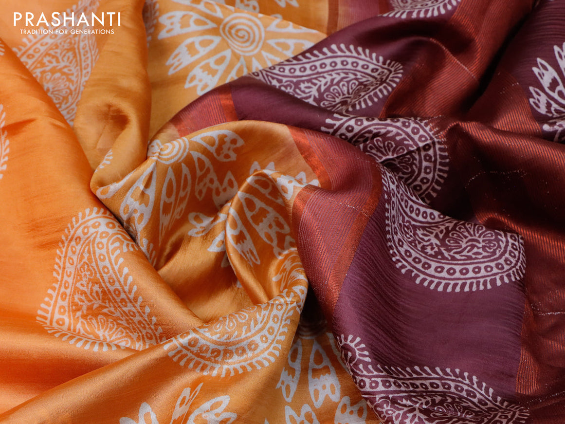Banana silk saree orange and deep maroon with allover paisley & floral prints and copper zari woven border
