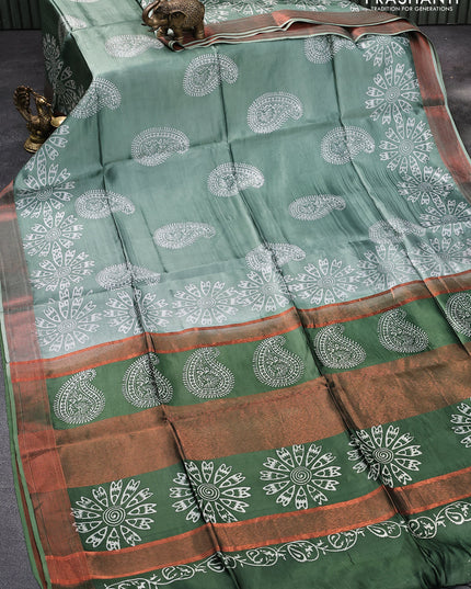 Banana silk saree pastel green and dark green with allover paisley & floral prints and copper zari woven border