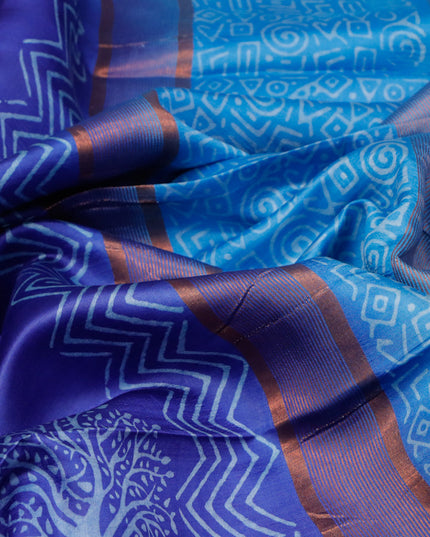 Banana silk saree blue and cs blue with tree butta prints and copper zari woven border