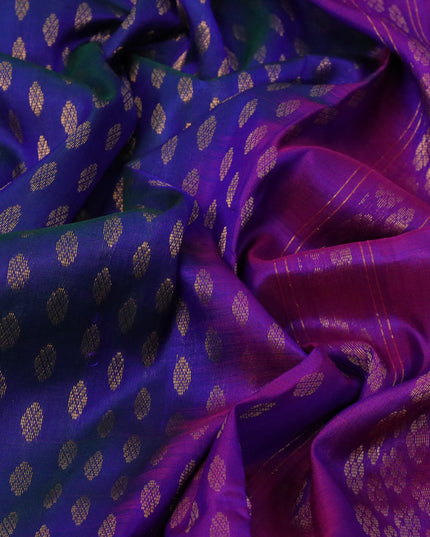 Pure uppada silk saree dual shade of bluish green and purple with allover zari woven buttas and long peacock design zari woven border