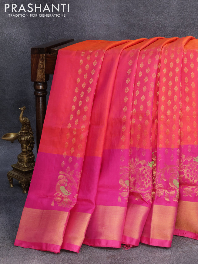 Pure uppada silk saree dual shade of pinkish orange and pink with allover zari woven buttas and long peacock design zari woven border