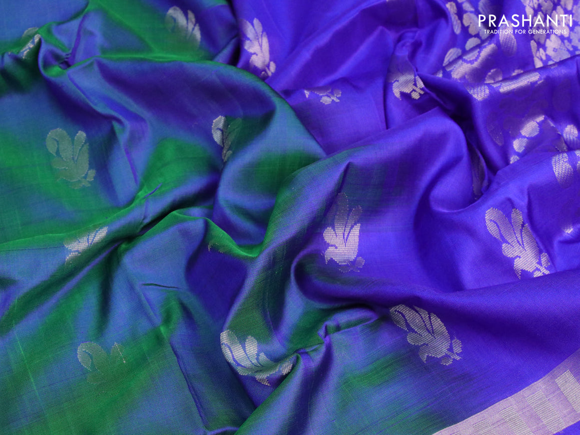 Pure uppada silk saree dual shade of bluish green and blue with silver zari woven buttas and silver zari woven butta border