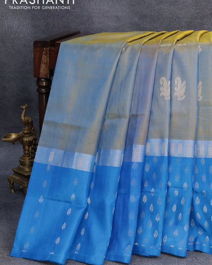 Pure uppada silk saree dual shade of bluish yellow and cs blue with silver zari woven buttas and silver zari woven butta border