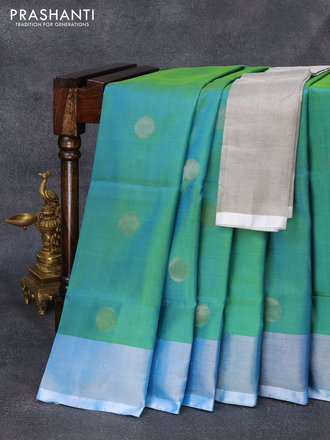 Pure uppada silk saree dual shade of teal green with silver zari woven coin buttas and silver zari woven border