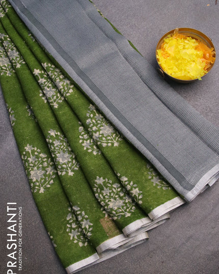 Pure linen saree sap green with butta prints and silver zari woven piping border