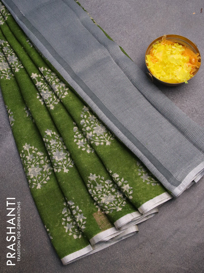 Pure linen saree sap green with butta prints and silver zari woven piping border