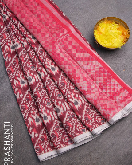 Pure linen saree deep maroon with allover ikat prints and silver zari woven piping border