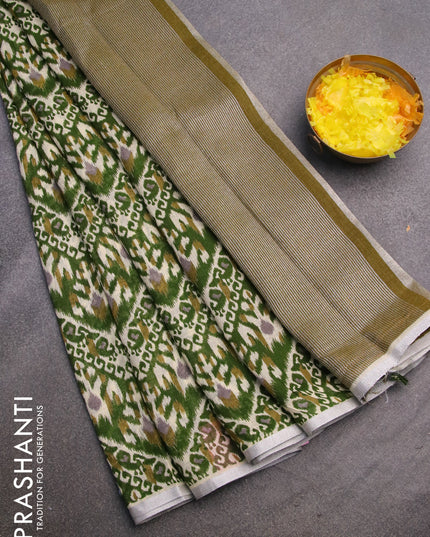 Pure linen saree green with allover ikat prints and silver zari woven piping border