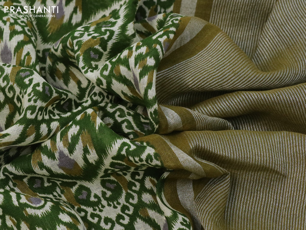 Pure linen saree green with allover ikat prints and silver zari woven piping border